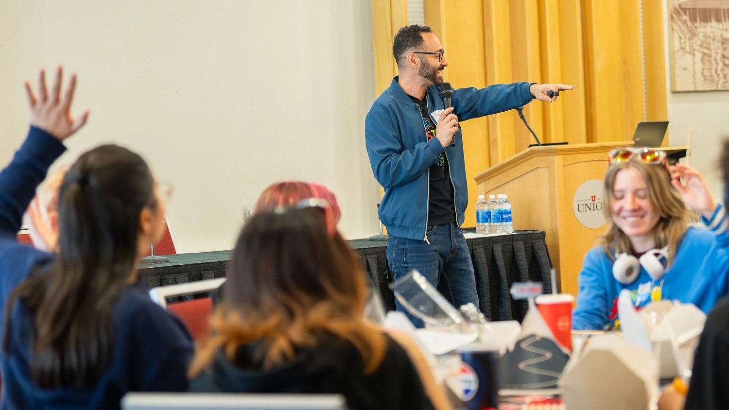 Bahaa facilitating an interactive session with an audience